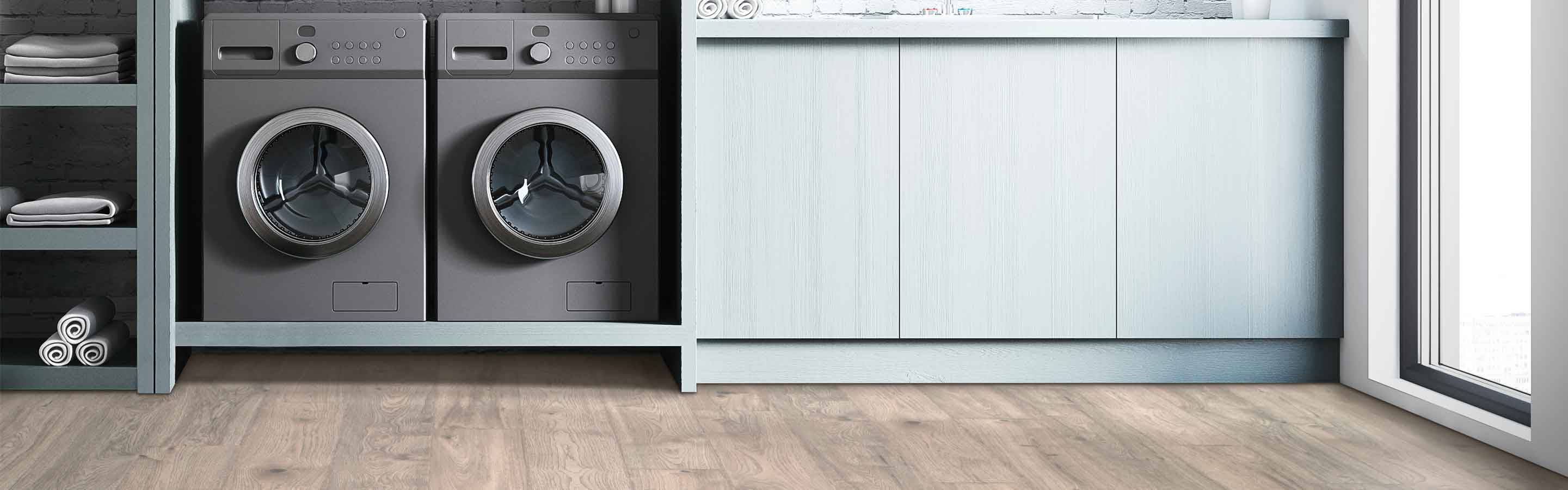 Laminate flooring in bathroom with sink and table